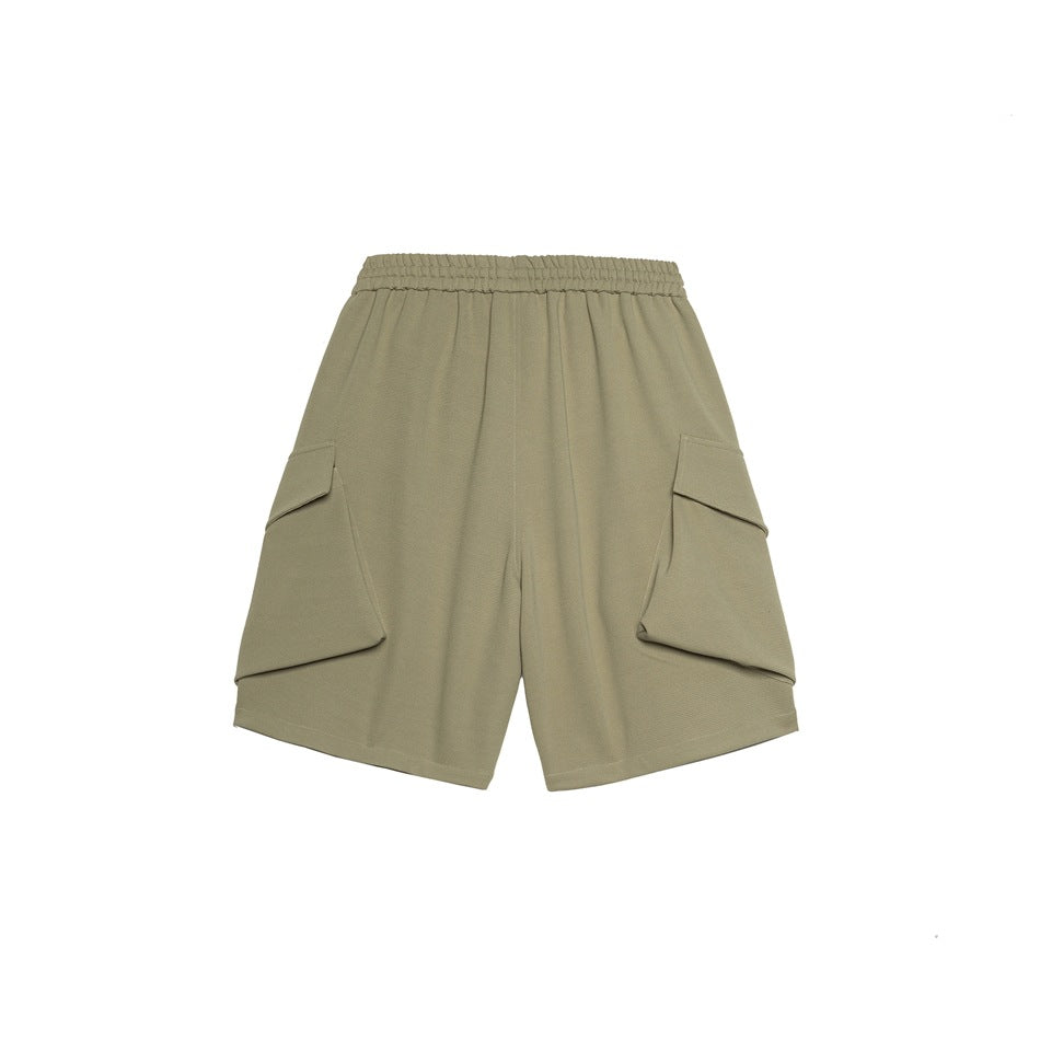 Back view of gray-green knit cargo shorts with elastic waistband and large side flap pockets