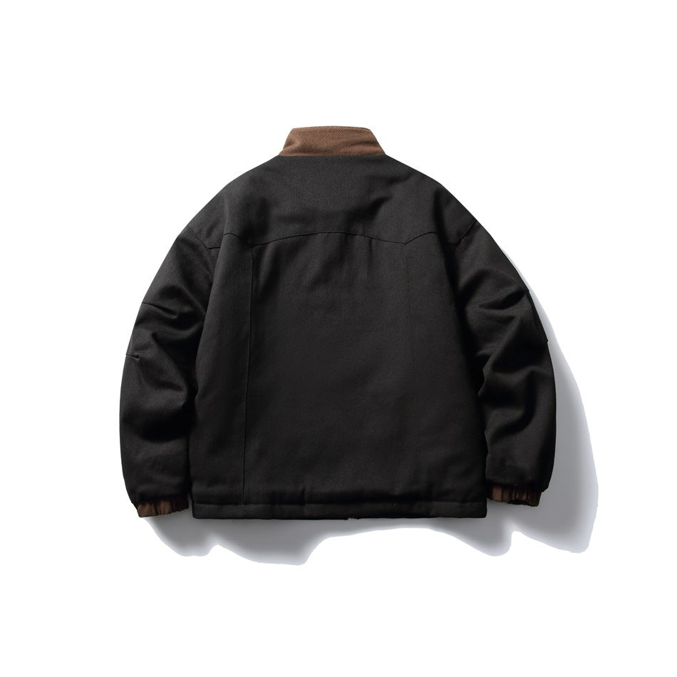 Back view of a black jacket with a brown collar and brown elastic cuffs, shown against a white background.