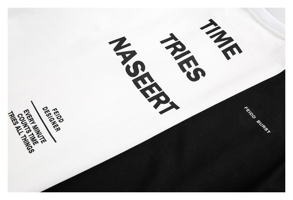 Close-up of a white shirt with a black panel and bold black text graphics, including “TIME TRIES NASEERT.”