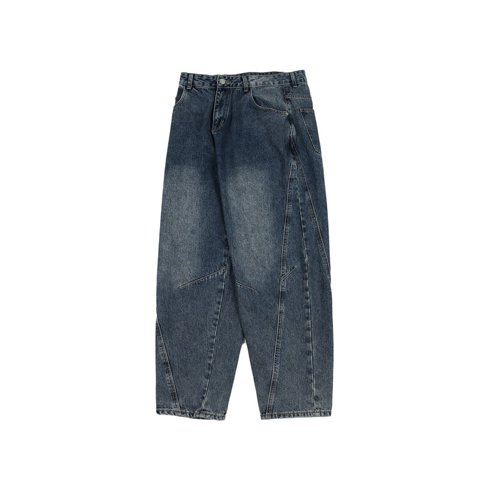 Full front view of dark blue washed jeans laid flat, with a high waist and very wide legs.