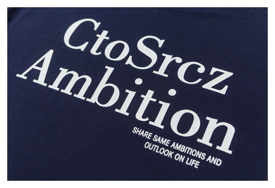 Close-up of large white lettering and a smaller slogan printed on navy fabric.