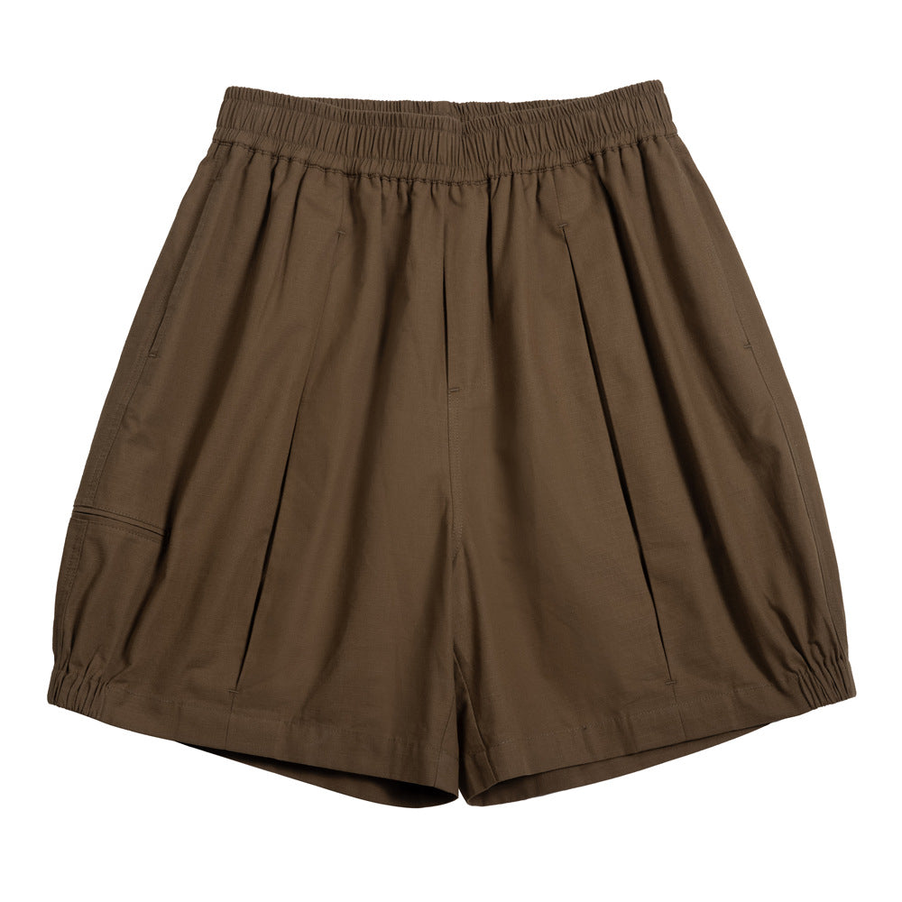 Coffee brown elastic-waist pleated knee-length shorts with a side thigh pocket and elasticized hems, flat lay front view
