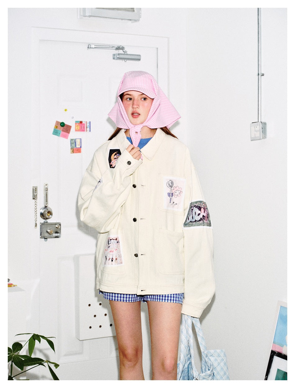 Model wearing an ivory patchwork button jacket, blue gingham shorts and a pink striped bonnet.