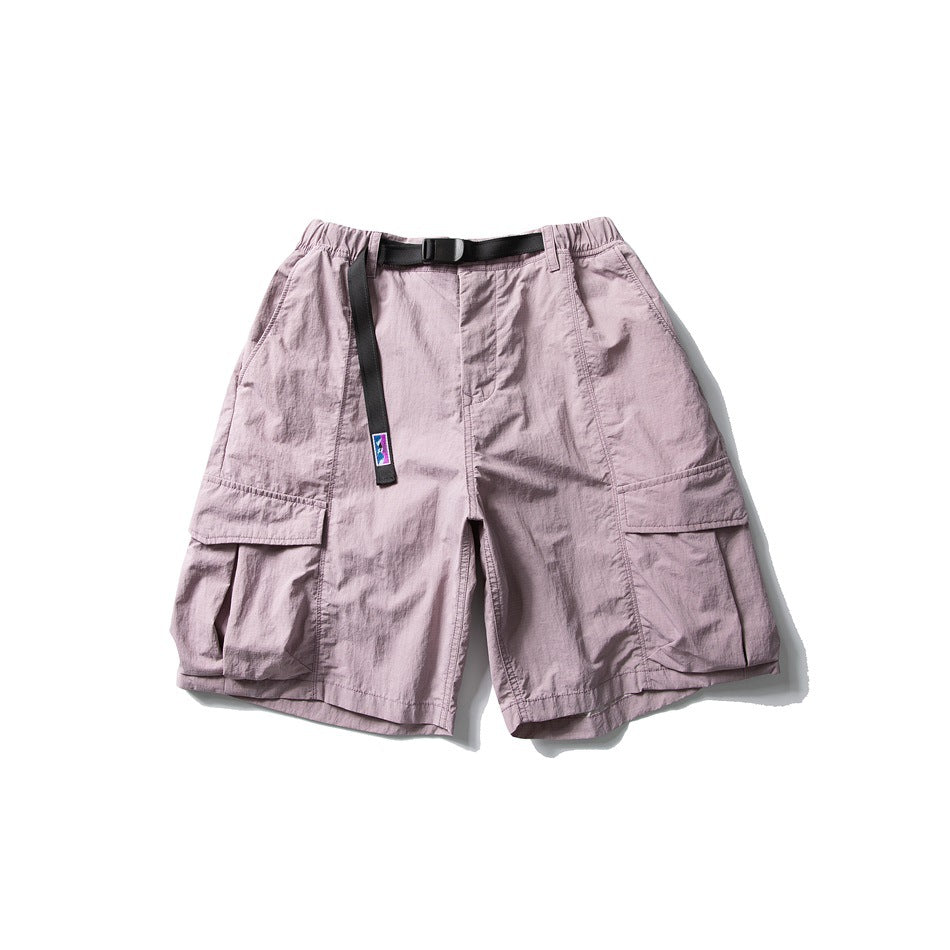 Taro purple cargo shorts with elastic waist, black buckle belt and large flap thigh pockets, flat lay front view
