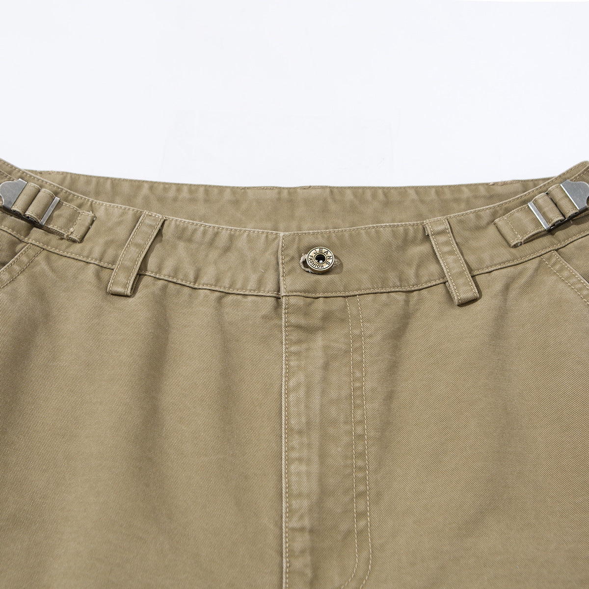 Close-up of khaki pants showing the front waistband, button, belt loops, and side adjusters.