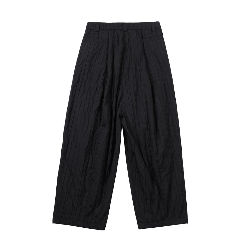 Full-length back view of black wide-leg trousers with a high waistband and rear pockets.