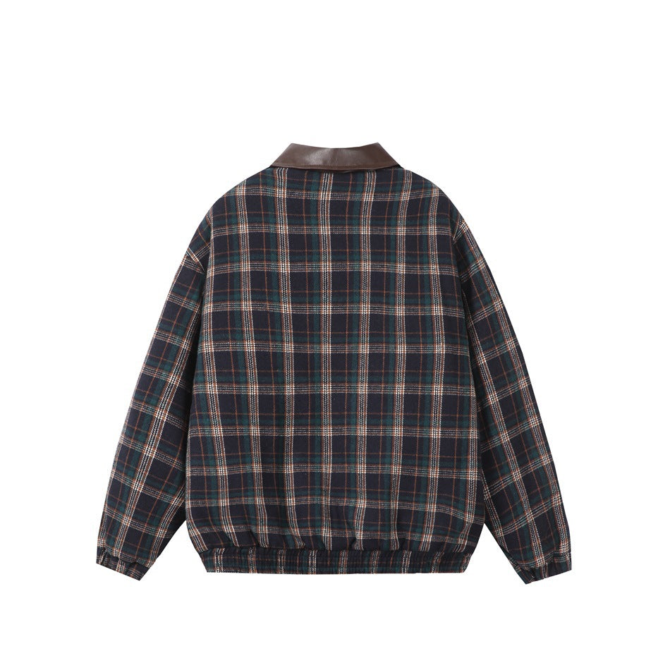 Back view of a dark navy plaid jacket with teal, rust, and light stripes, a dark brown collar, and elastic hem and cuffs.