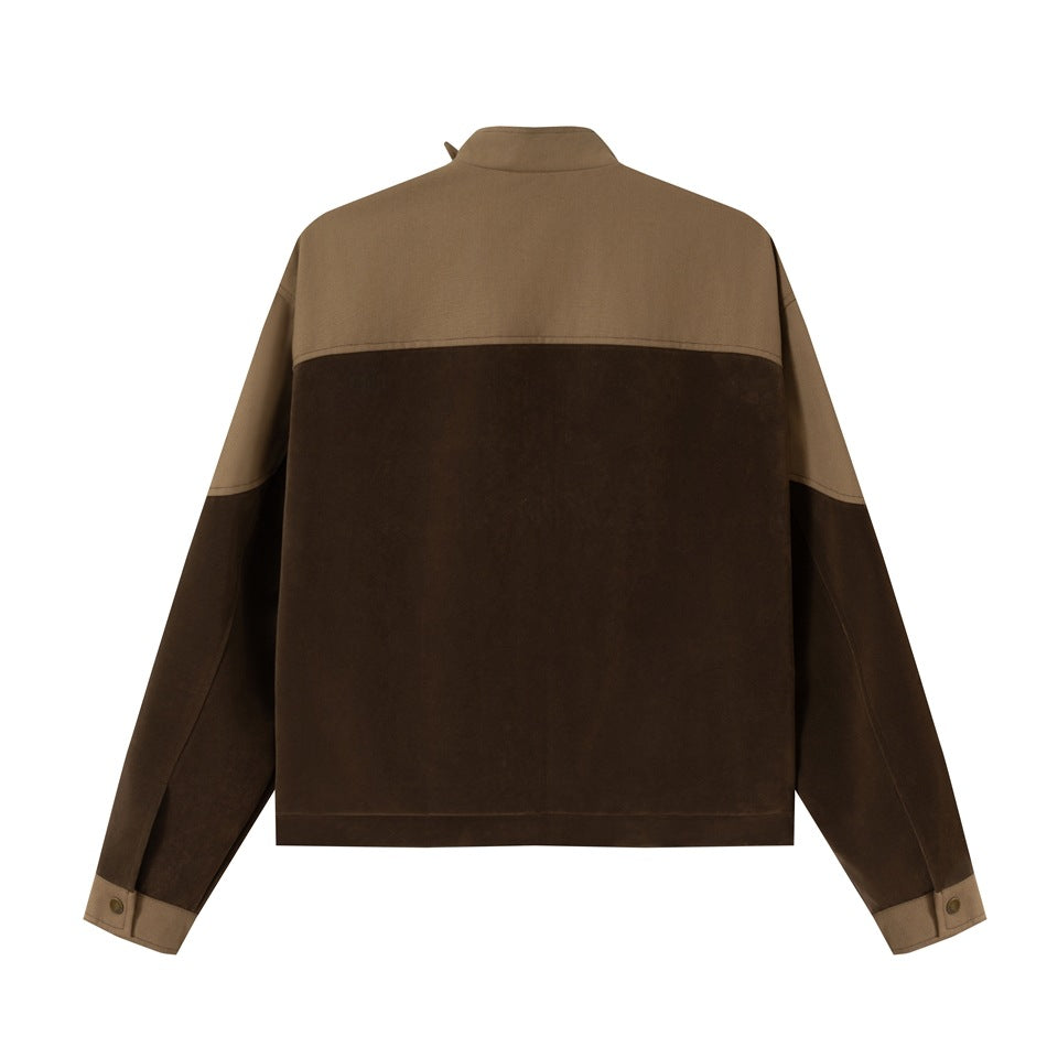 Back view of a brown jacket with a tan upper yoke, tan sleeve panels, and buttoned cuffs.