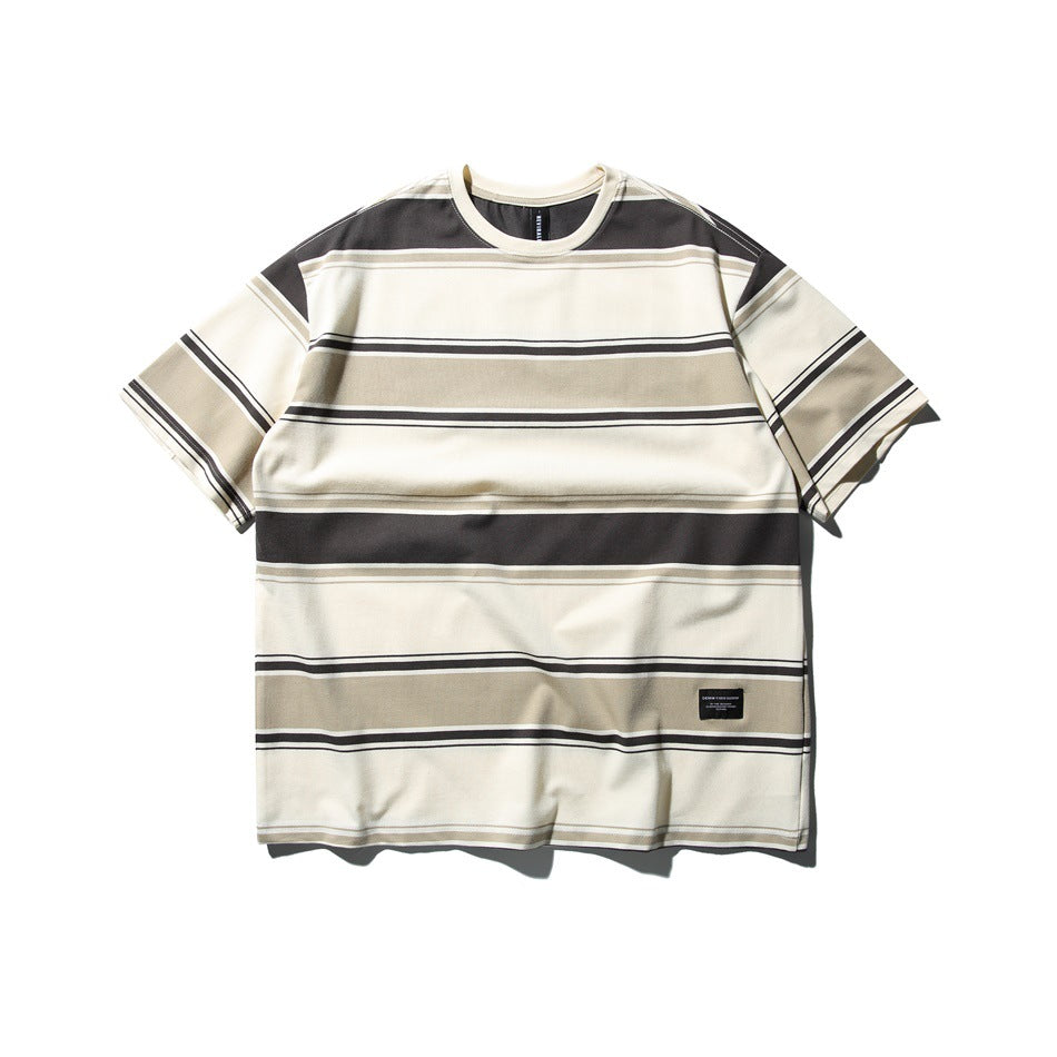 Front of a gray striped short-sleeve crew-neck T-shirt with cream, beige and charcoal stripes and a small black label