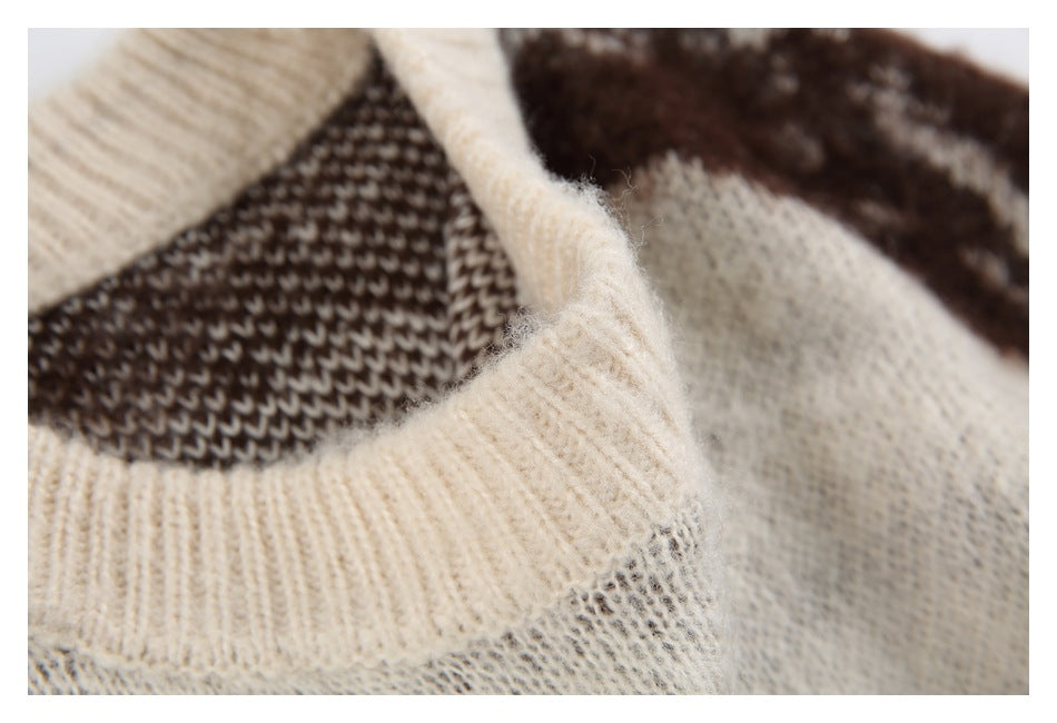 Close-up of a cream ribbed neckline and fuzzy brown-and-cream knit pattern.
