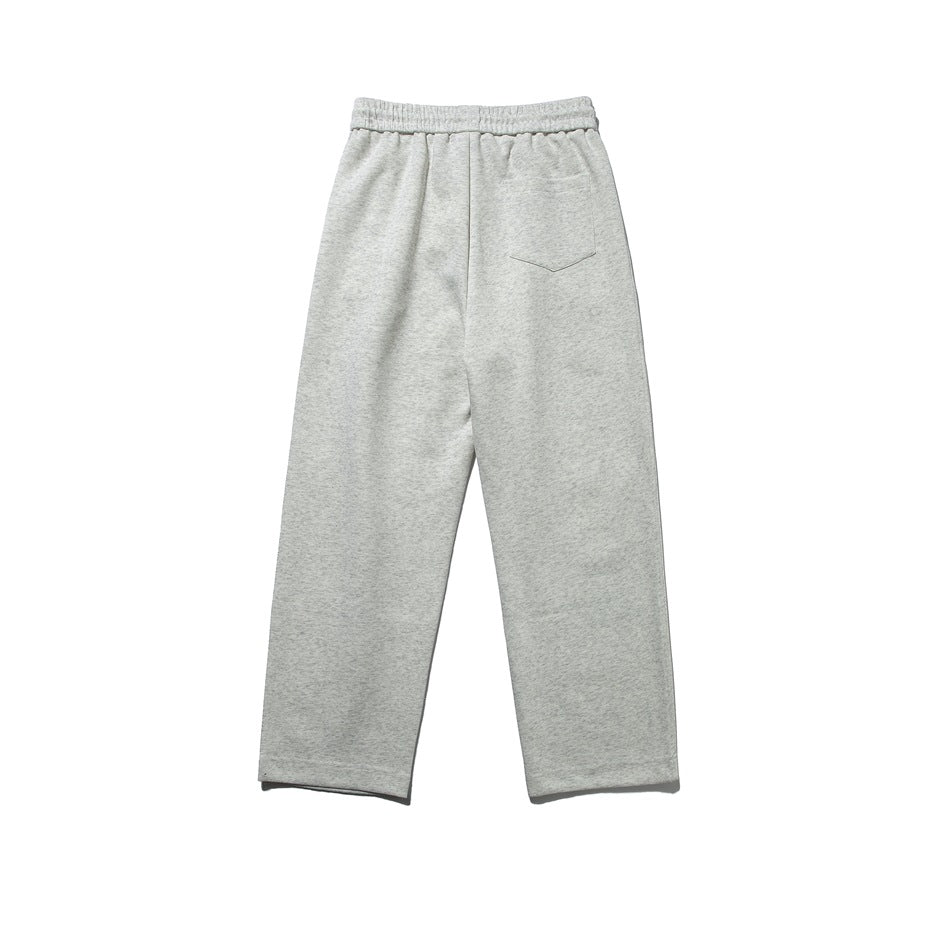 Back view of light gray relaxed pants with an elastic waistband and a single back pocket.
