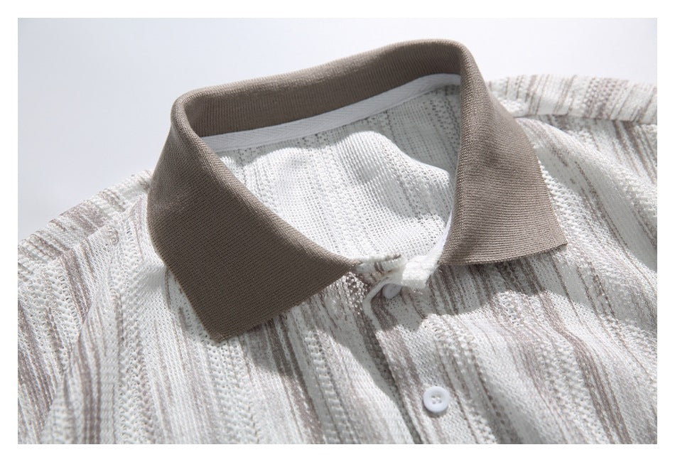Close-up of an ivory knit polo shirt with taupe collar, openwork vertical stripes and white buttons.