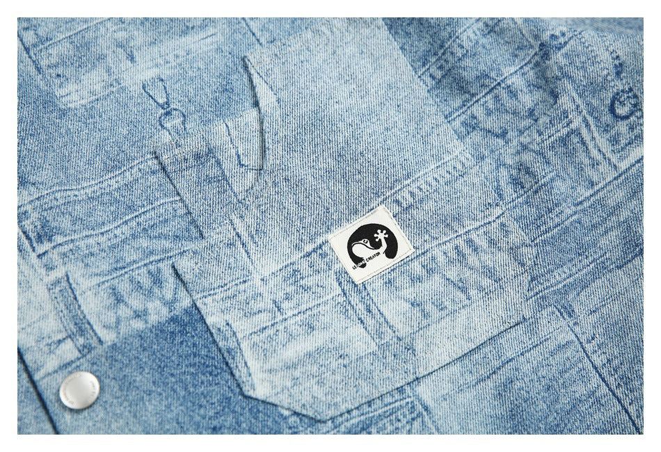 Close-up of a chest pocket and small black-and-white sewn patch on the light blue patchwork-print shirt.