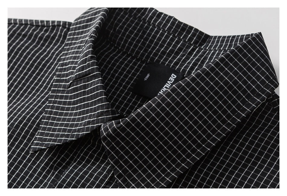 Close-up of the shirt collar, fine-grid pattern and inner neck label.