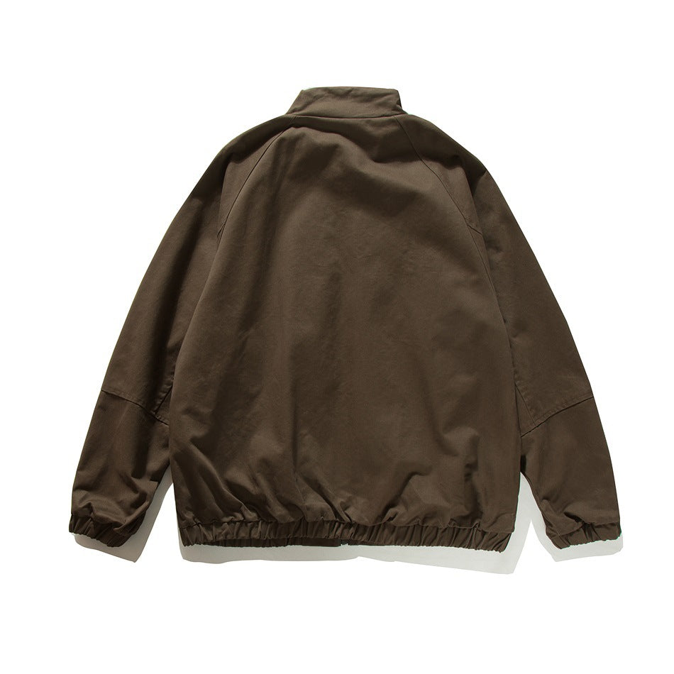 Back view of a dark brown jacket with a high collar, raglan sleeves, and gathered cuffs and hem.