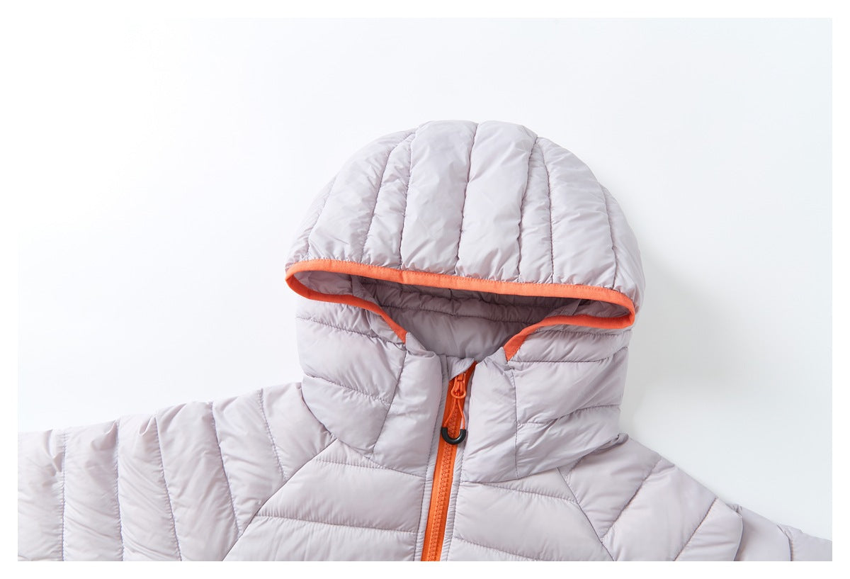 Close-up of the pale lavender quilted jacket's hood and upper front, showing orange trim and zipper.