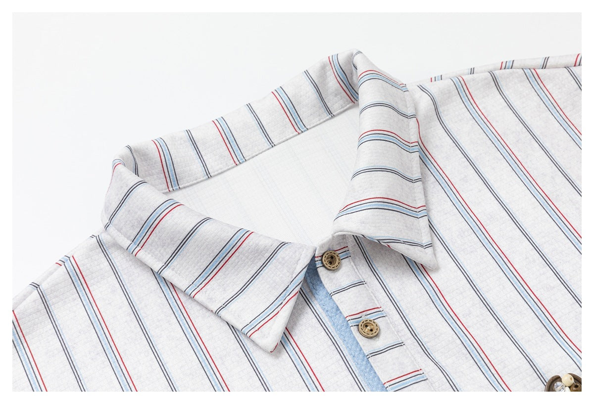 Close-up of the striped shirt's pointed collar, placket, and brown buttons.