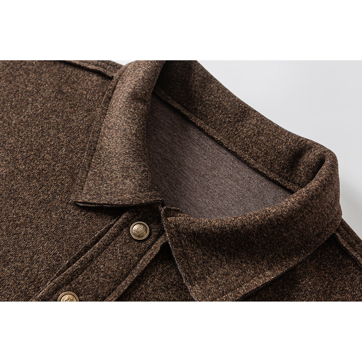 Close-up of a brown heathered pullover's pointed collar and short button placket.