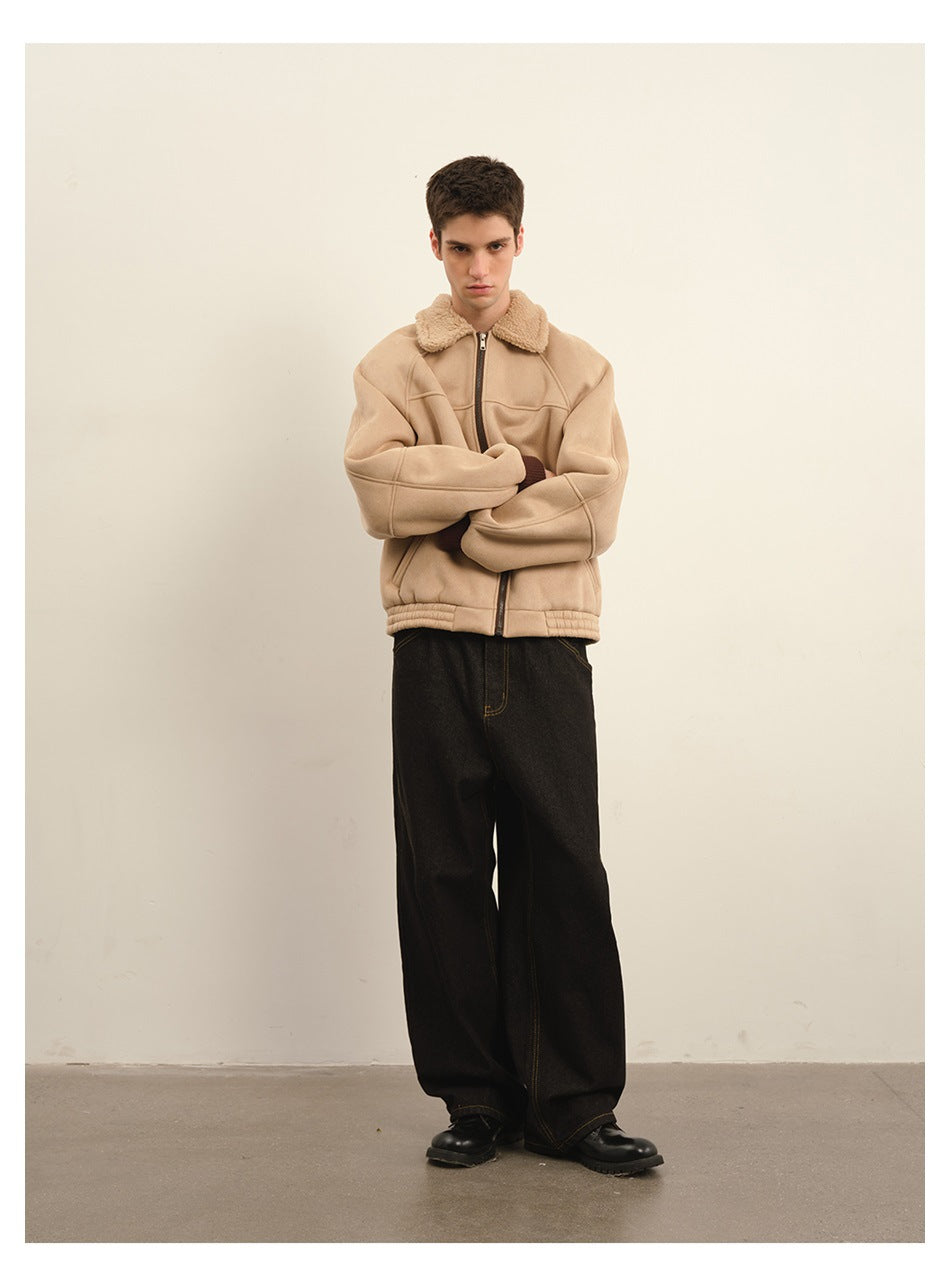 Front view of a model wearing a beige zip jacket with a plush collar and wide-leg black trousers.