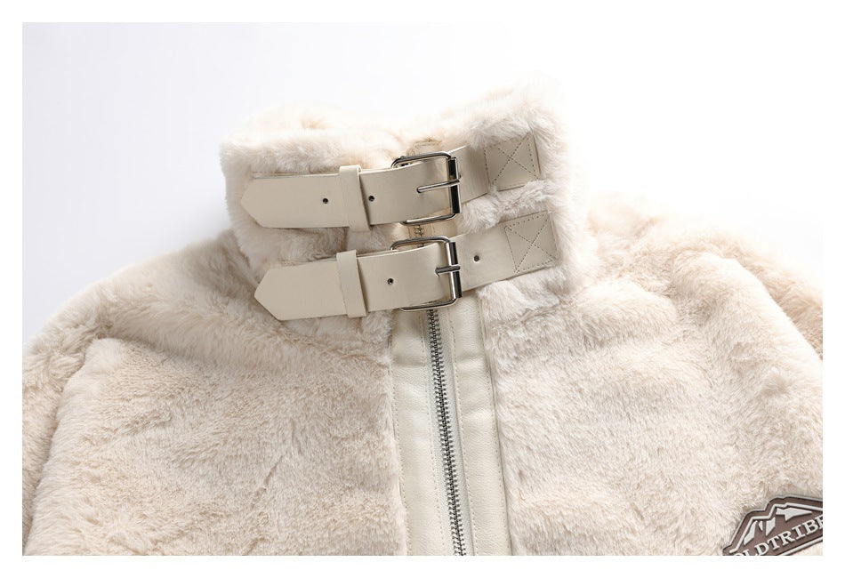 Close-up of an ivory faux-fur jacket collar with two beige buckle straps and a silver zipper.