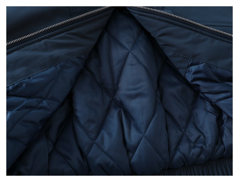 Close-up of the jacket's open interior, showing diamond-quilted navy lining.