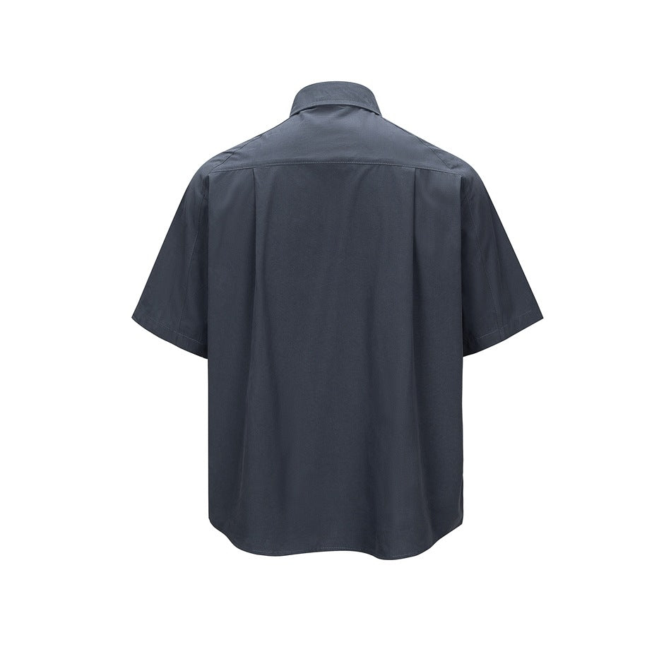 Back view of a dark slate-blue short-sleeve button-up shirt.