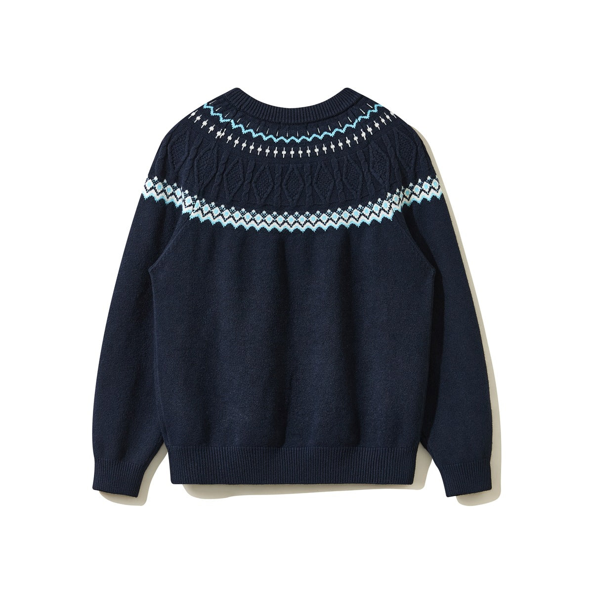 Back view of a navy crewneck sweater with a blue-and-cream patterned cable-knit yoke and ribbed trim.