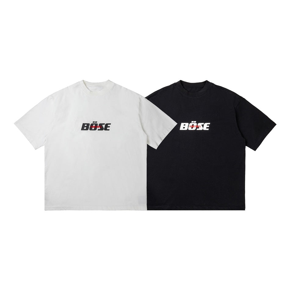 White and black short-sleeve crew-neck T-shirts shown side by side, each with a small chest graphic.