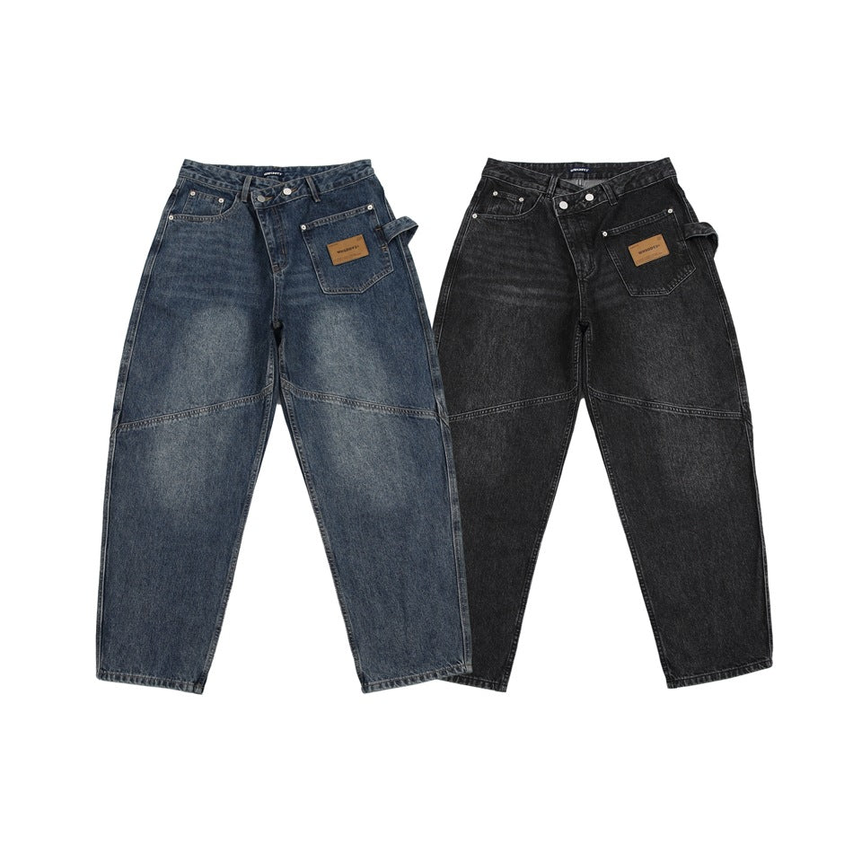 Two pairs of loose-fit jeans shown from the front: one washed blue and one charcoal black.