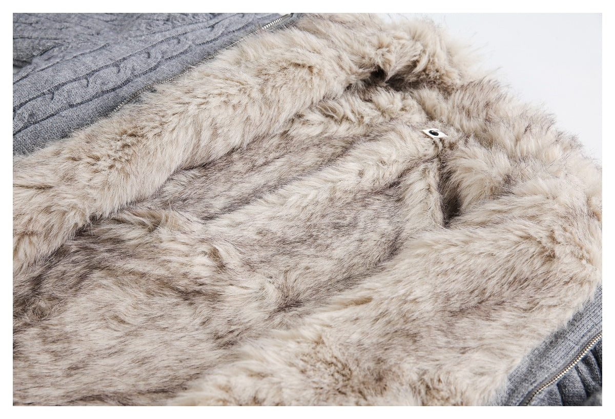 Close-up of a pale beige fluffy lining beside gray knit fabric and a metal zipper.