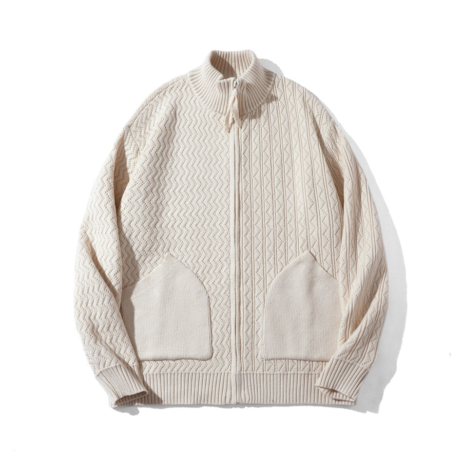 Apricot knit zip-up cardigan with stand collar, textured zigzag pattern and two patch pockets, flat lay