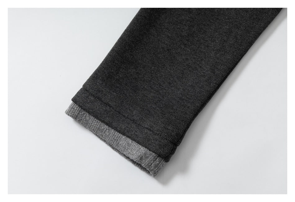 Charcoal sleeve cuff with a lighter gray knit layer visible underneath.