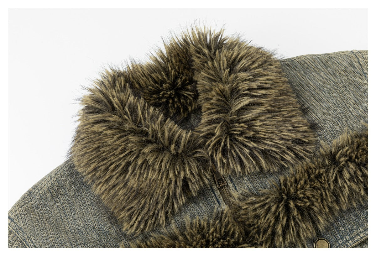 Close-up of the jacket's thick brown-black fur collar and textured blue-gray fabric.