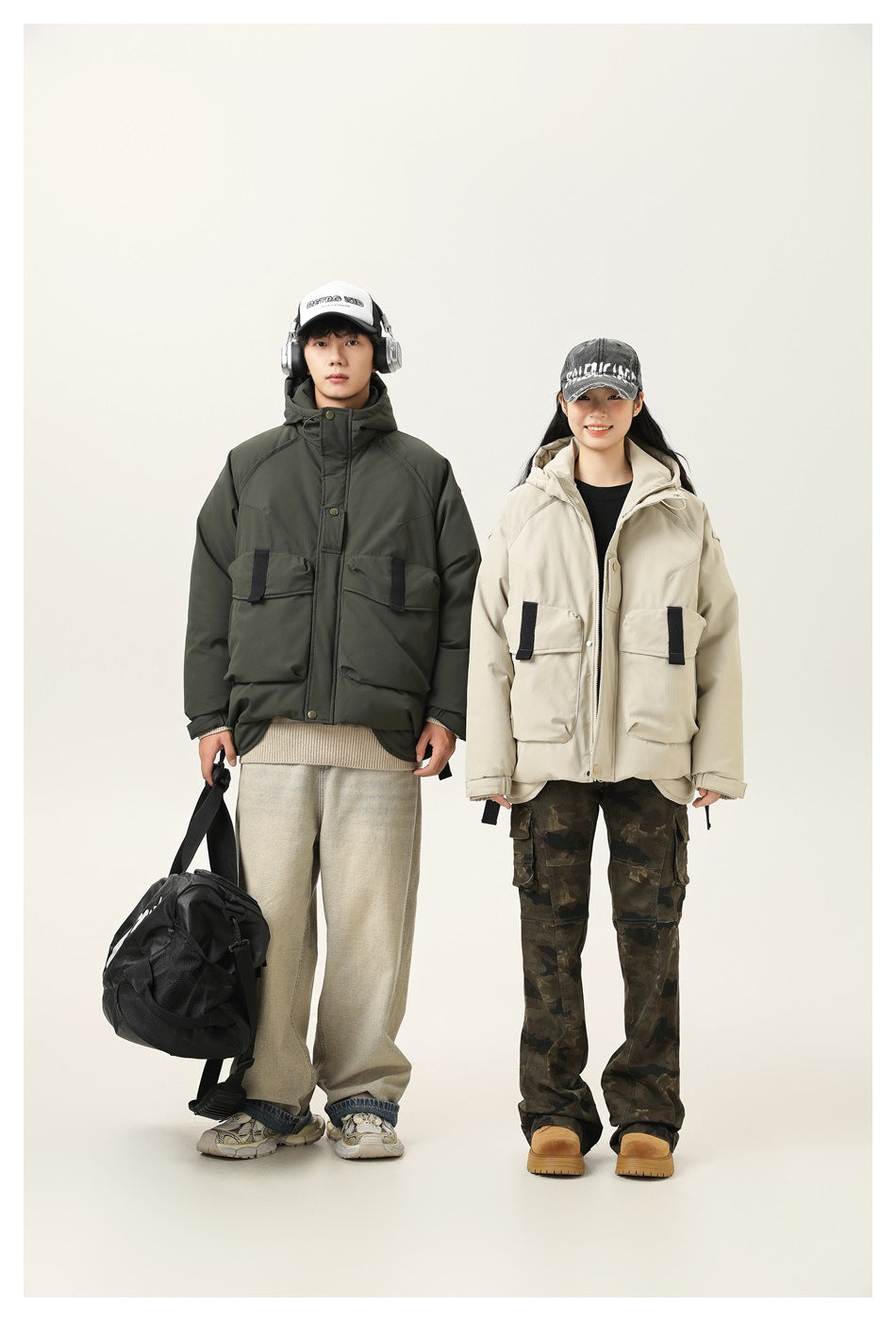 Two models wear hooded utility jackets: one dark olive and one light beige, each with large front flap pockets.