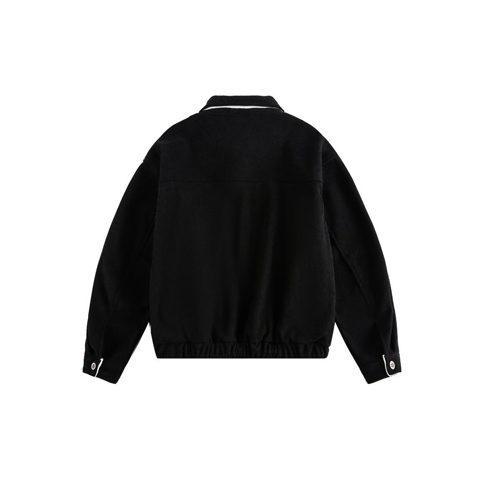 Back view of a black jacket with a gathered hem, buttoned cuffs, and a narrow white accent at the collar.