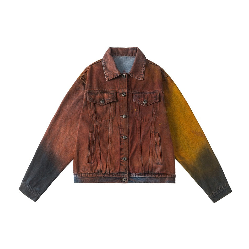 Rust-red denim-style jacket with orange-yellow and black faded sleeves, button front and chest flap pockets, flat lay