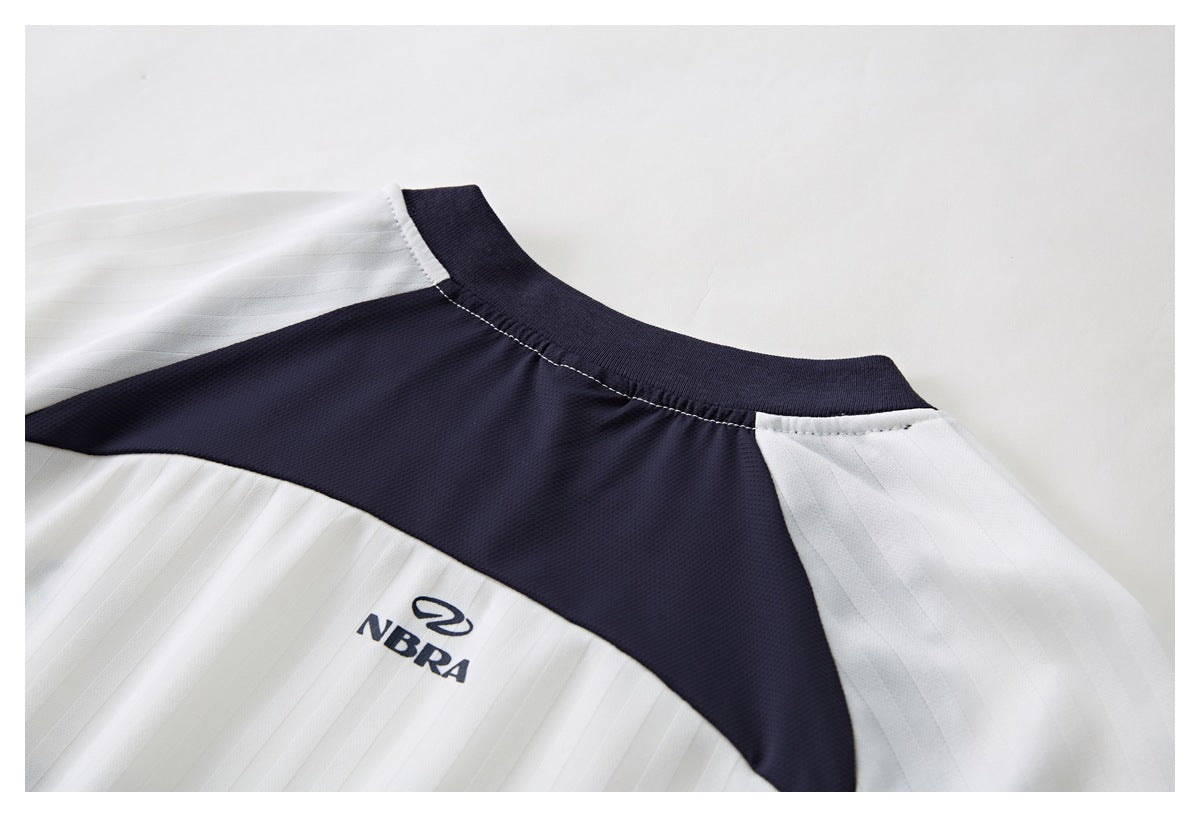 Close-up of the jersey's back neckline, navy shoulder yoke, white pinstriped panels, and small navy logo.