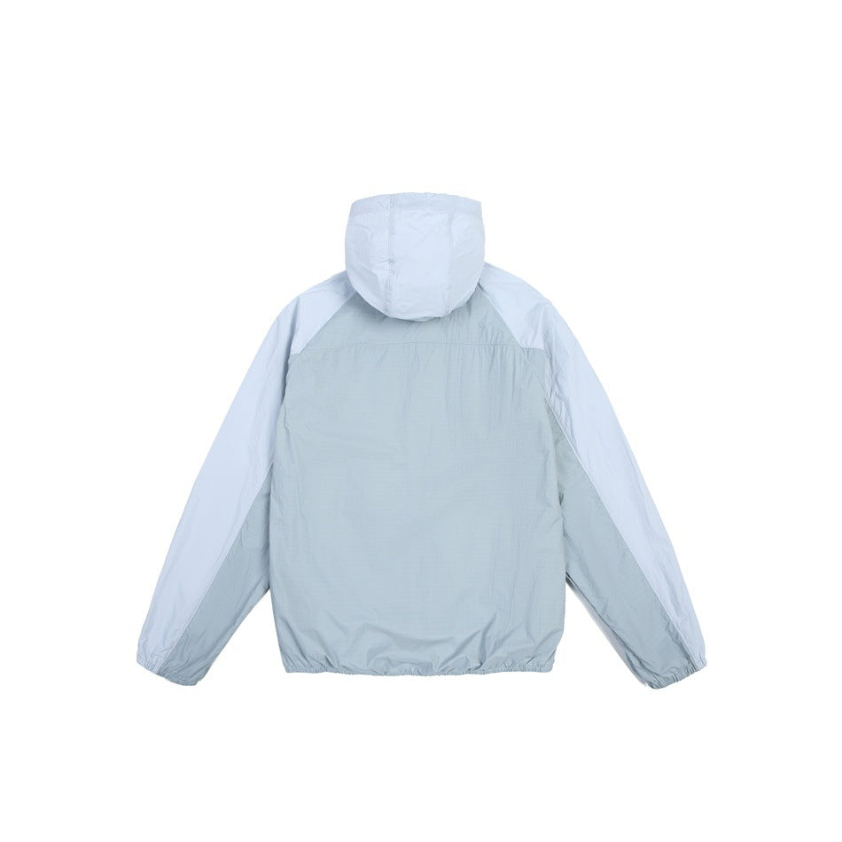 Back view of a pale blue-gray hooded jacket with light blue sleeves, elastic cuffs, and hem.