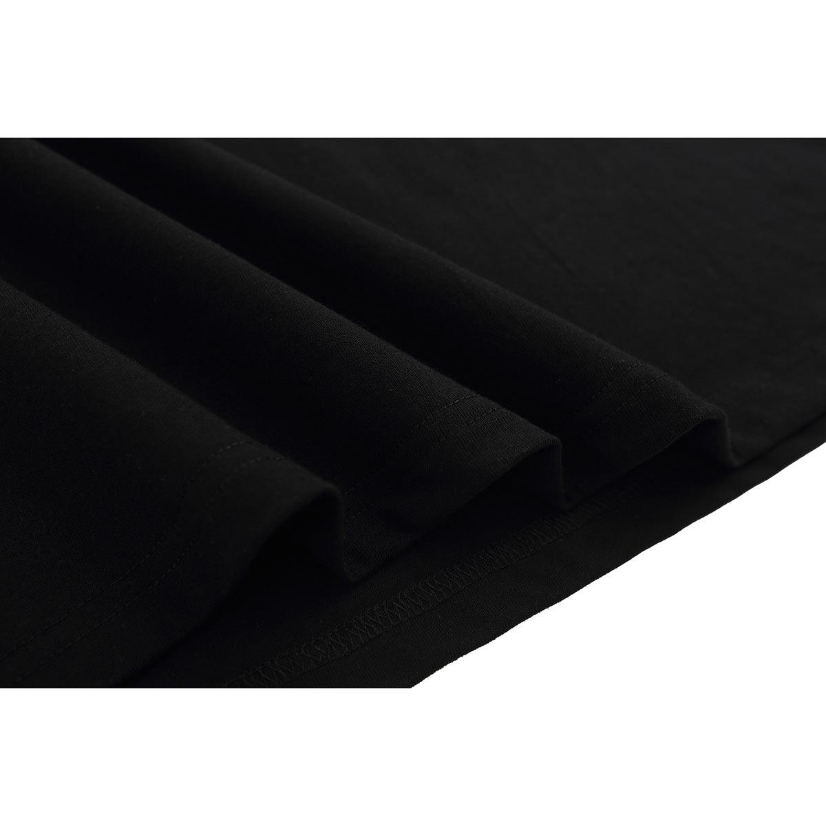 Close-up of the black T-shirt fabric and stitched hem.