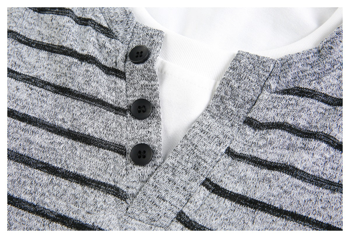 Close-up of the striped Henley placket with three black buttons and a white inner layer at the neckline.
