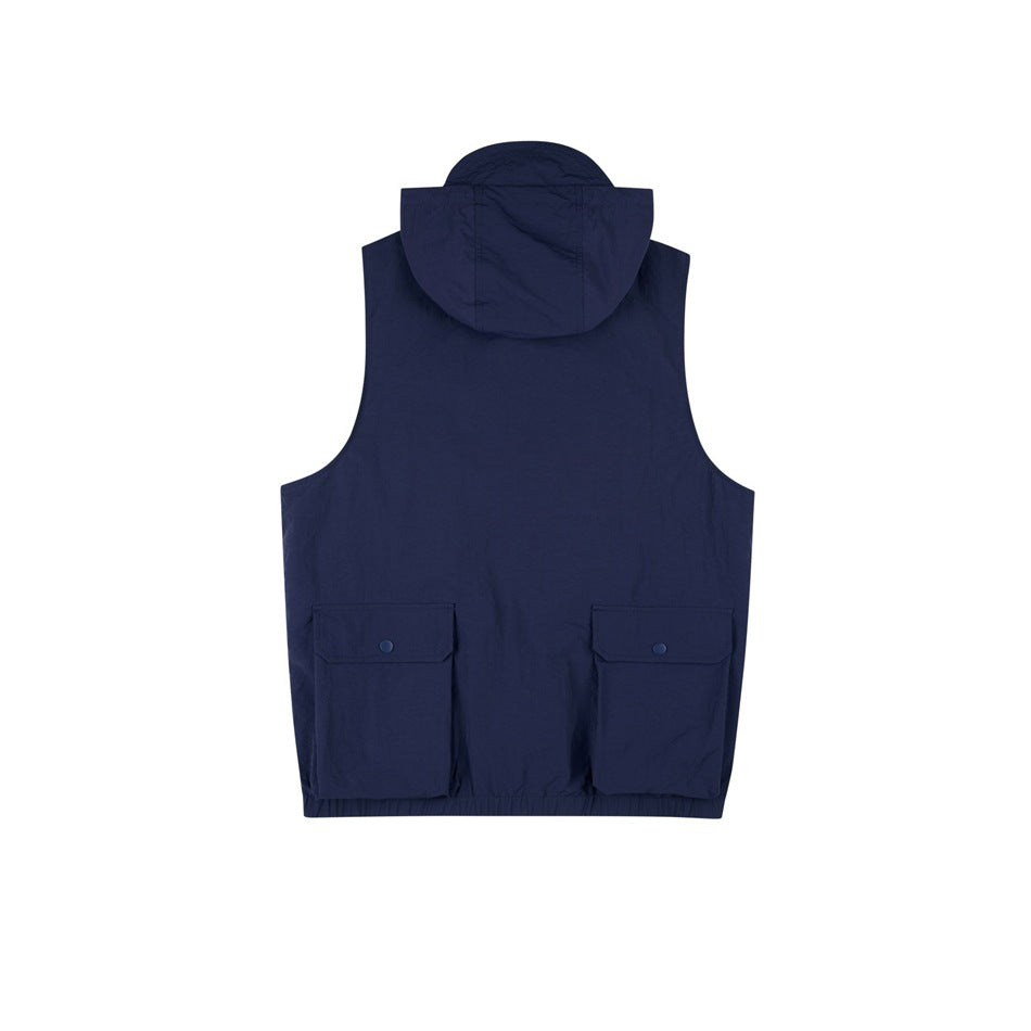 Back view of a navy sleeveless utility vest with a hood and two large flap pockets.