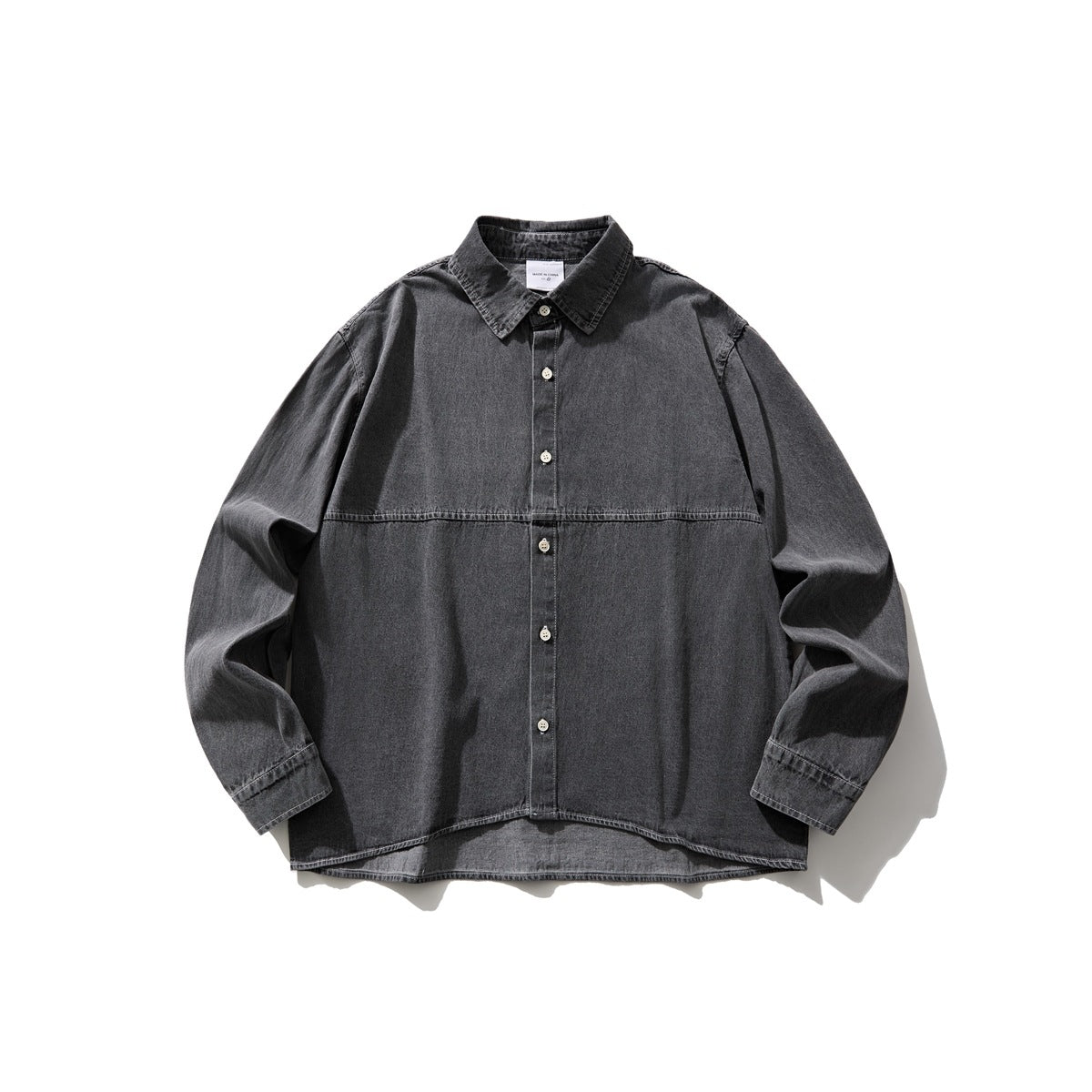 Faded gray washed denim button-front shirt flat lay with collar, chest seam and button cuffs