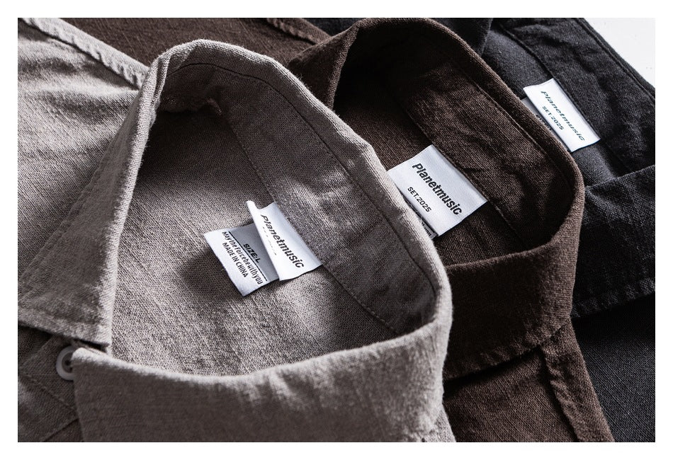Close-up of gray, brown, and black shirt collars with sewn-in brand and size labels.
