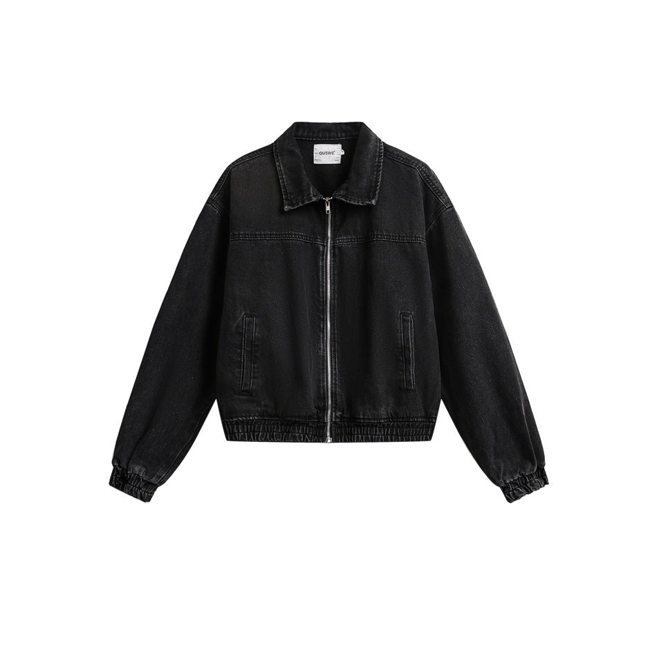 Faded black denim zip jacket with collar, slit pockets and elastic cuffs and hem, flat front view