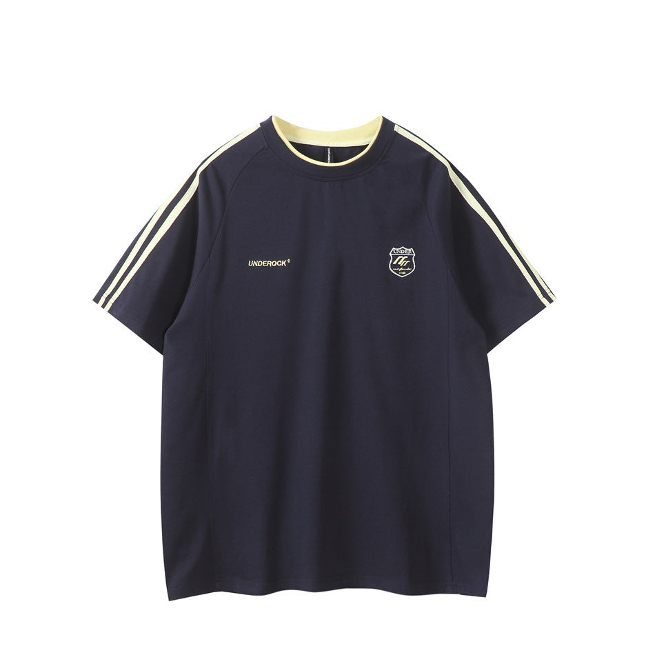 Navy raglan T-shirt with pale yellow collar trim, shoulder stripes and embroidered chest crest, front view