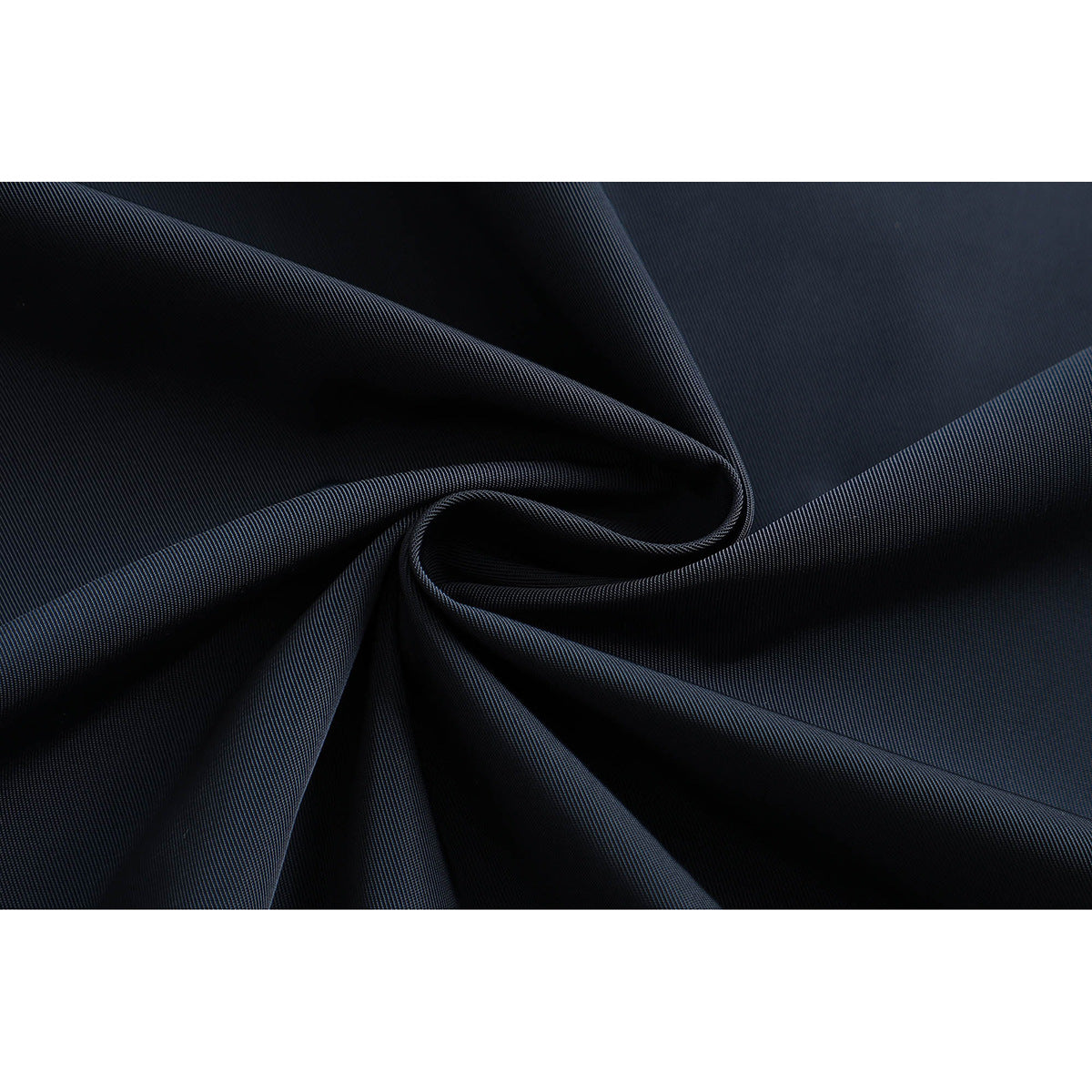 Close-up of dark navy fabric arranged in soft folds.