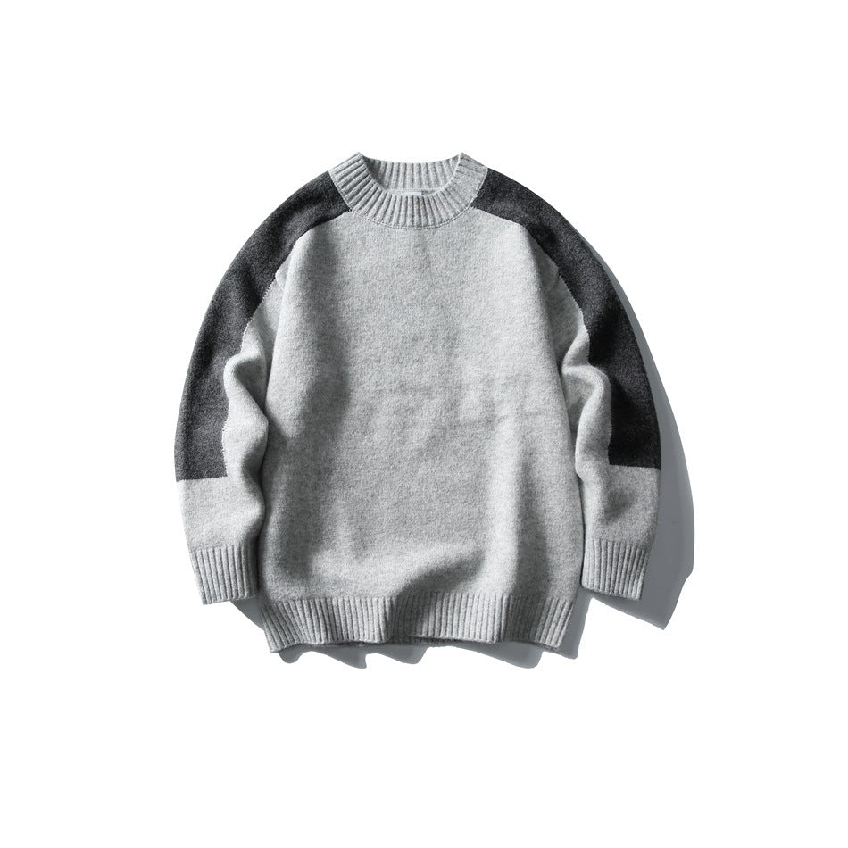 Light gray crew-neck knit sweater with dark gray shoulder and sleeve panels and ribbed trim, flat lay front view