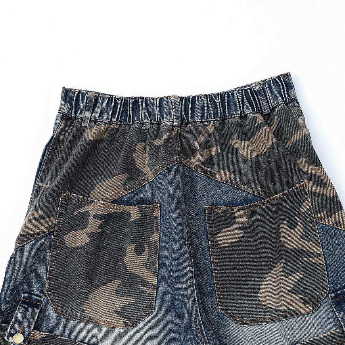 Close-up of the jeans' back waistband and two camouflage-patterned rear pockets.