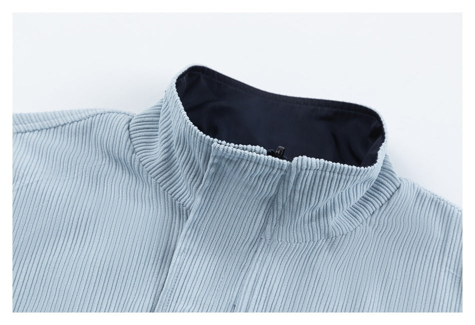 Close-up of a pale blue ribbed collar with dark navy lining.