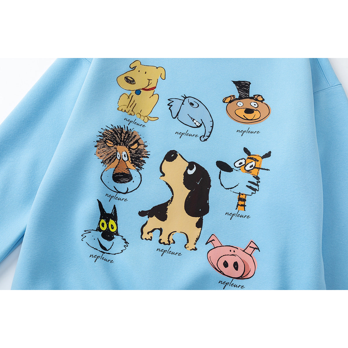 Close-up of a light blue sweatshirt printed with colorful cartoon animal faces and figures.